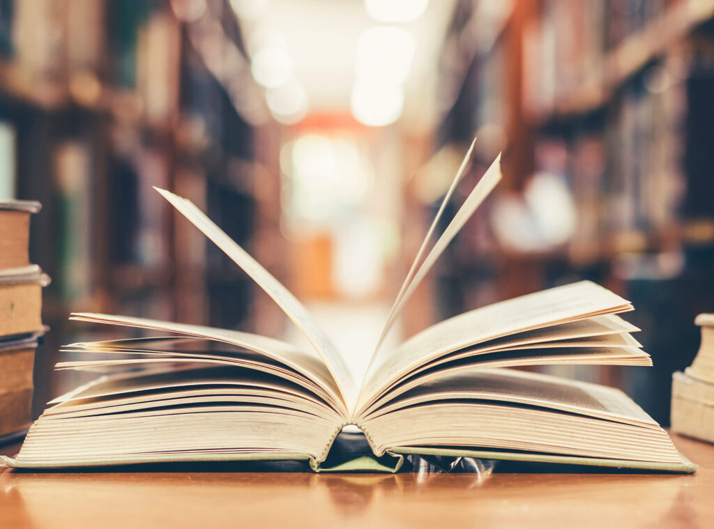 An open library book on a table